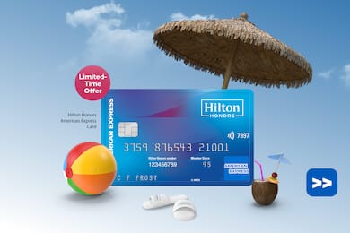 Hilton Honors American Express Base Card floating on a sky background